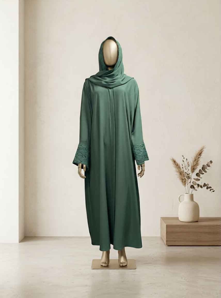 Green abaya on a mannequin against a neutral background